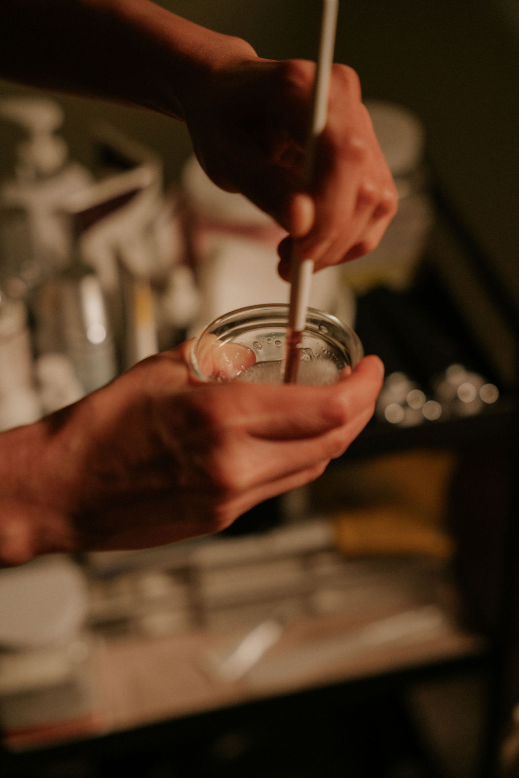 Esthetician preparing facial products at Siam Ivory
